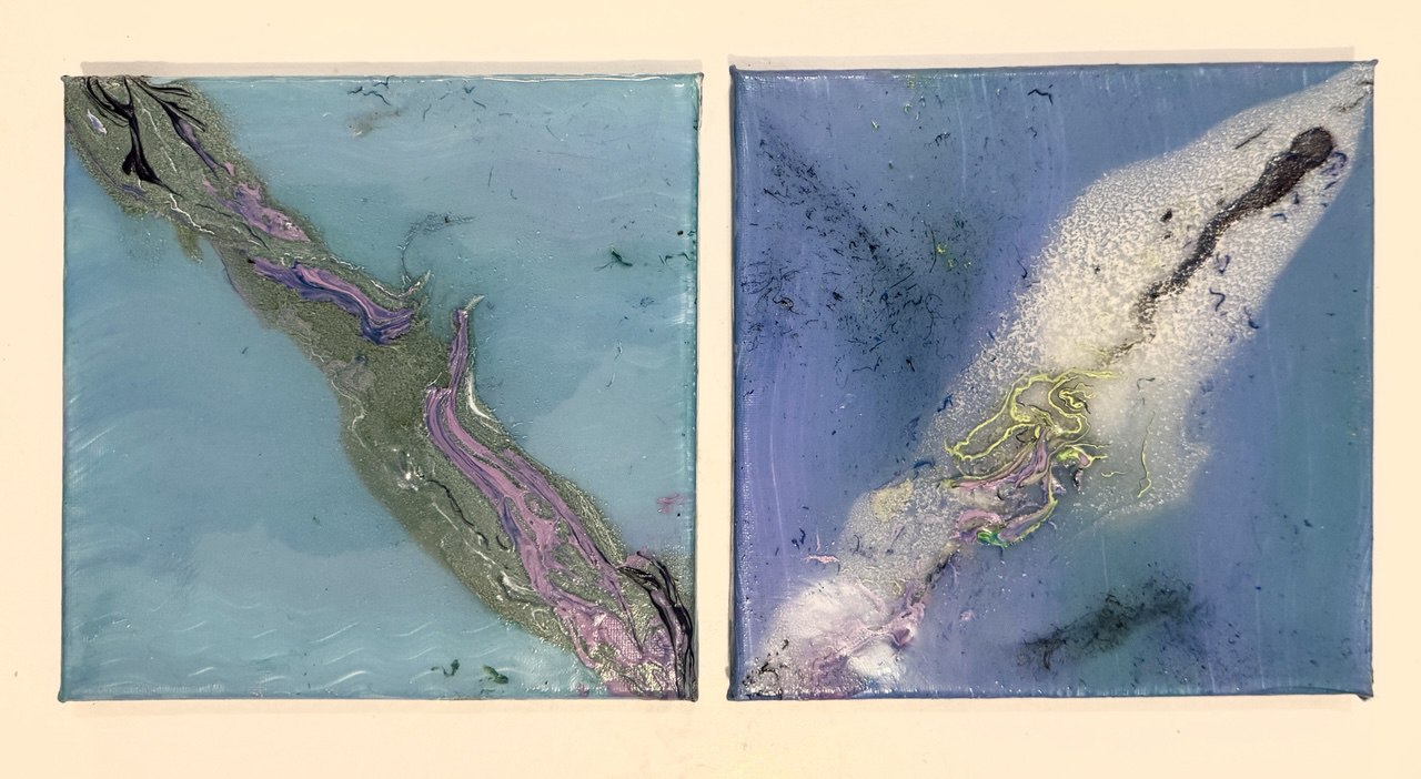 Two square panels in cool blue tones with glossy resin; elongated organic forms and delicate neon-like lines float within.